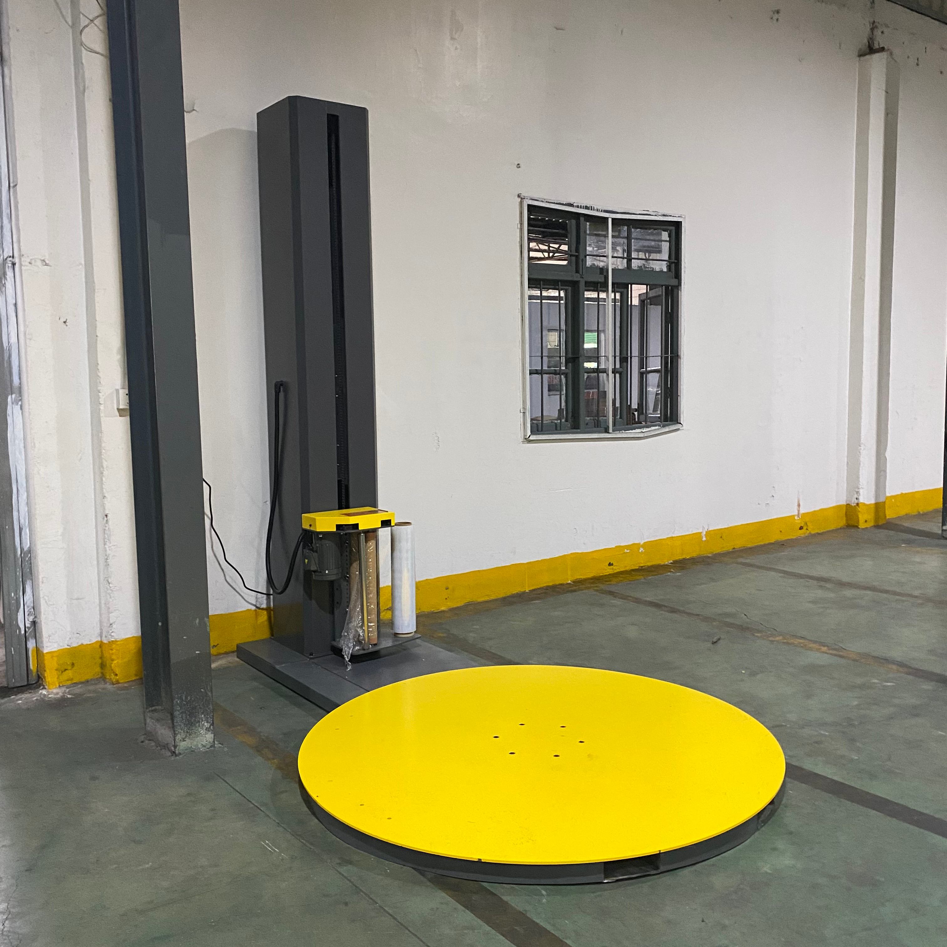 New automatic stretch wrapping machine at Elisha's production facility.jpg