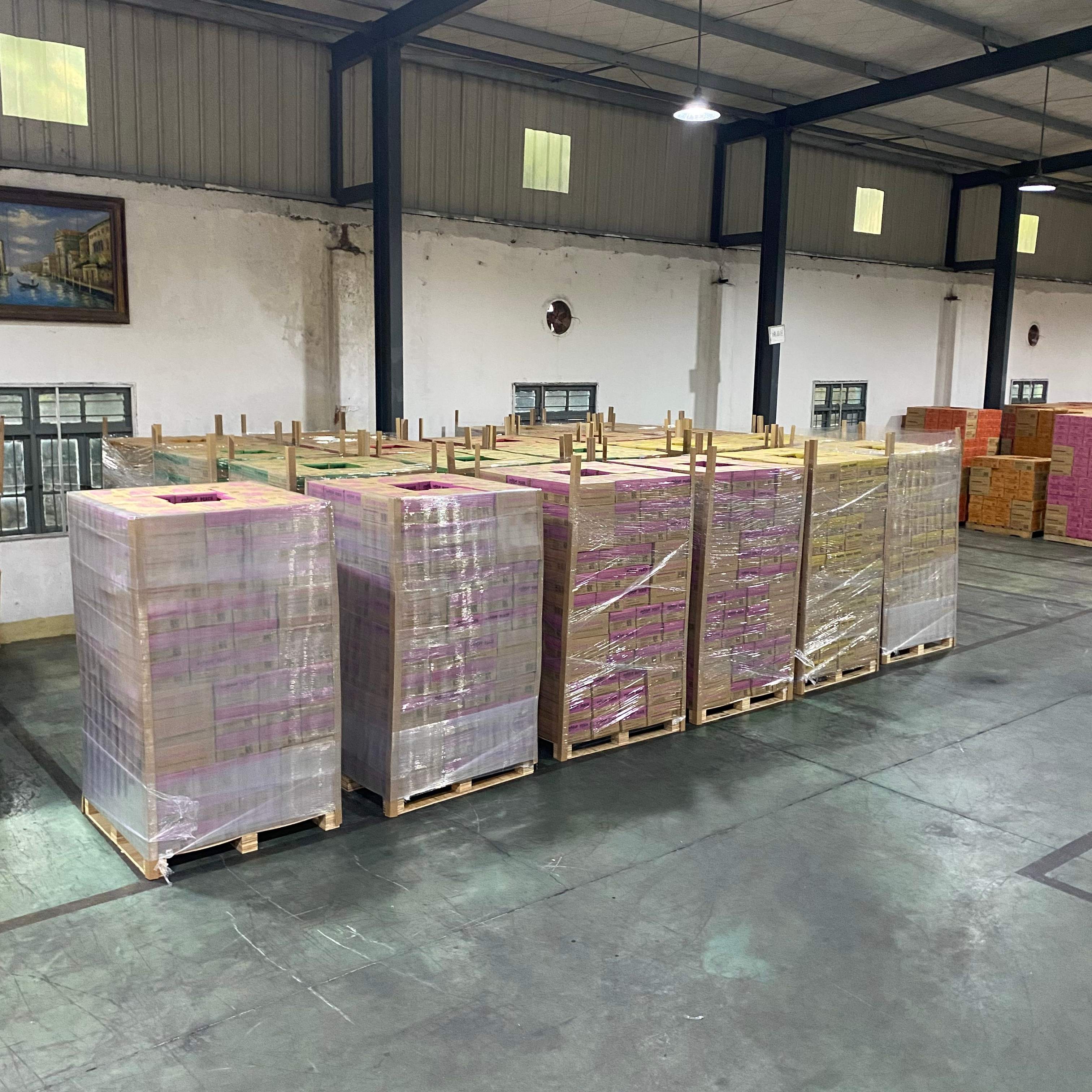 Pallets of fruit flavoured sparkling drinks wrapped and ready for sea freight.jpg